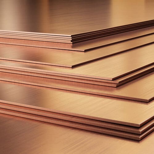 copper washers on black metal mesh background